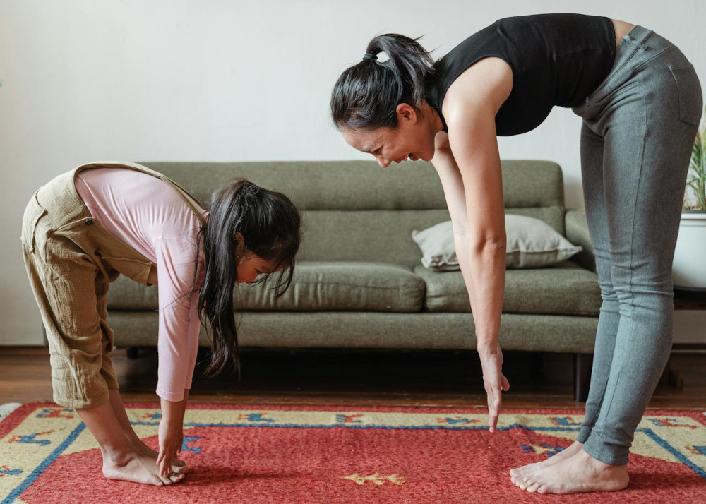 woman exercising with her daughter